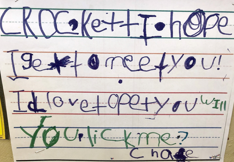 A child's handwritten note to one of the Buckeye Paws dogs after a visit